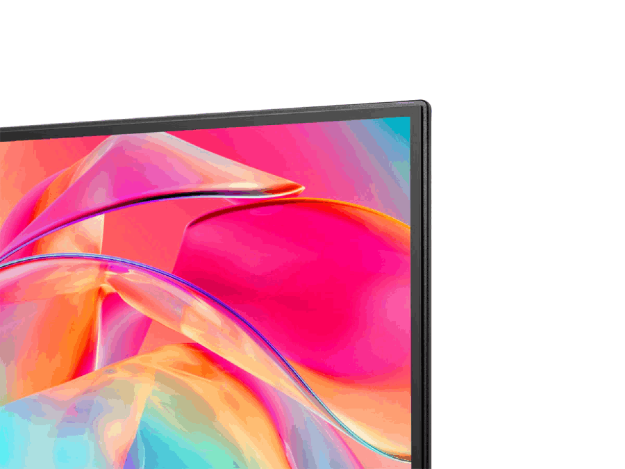 Primer plano de una esquina de pantalla de TV. Muestra formas abstractas coloridas con rosas, azules y morados.