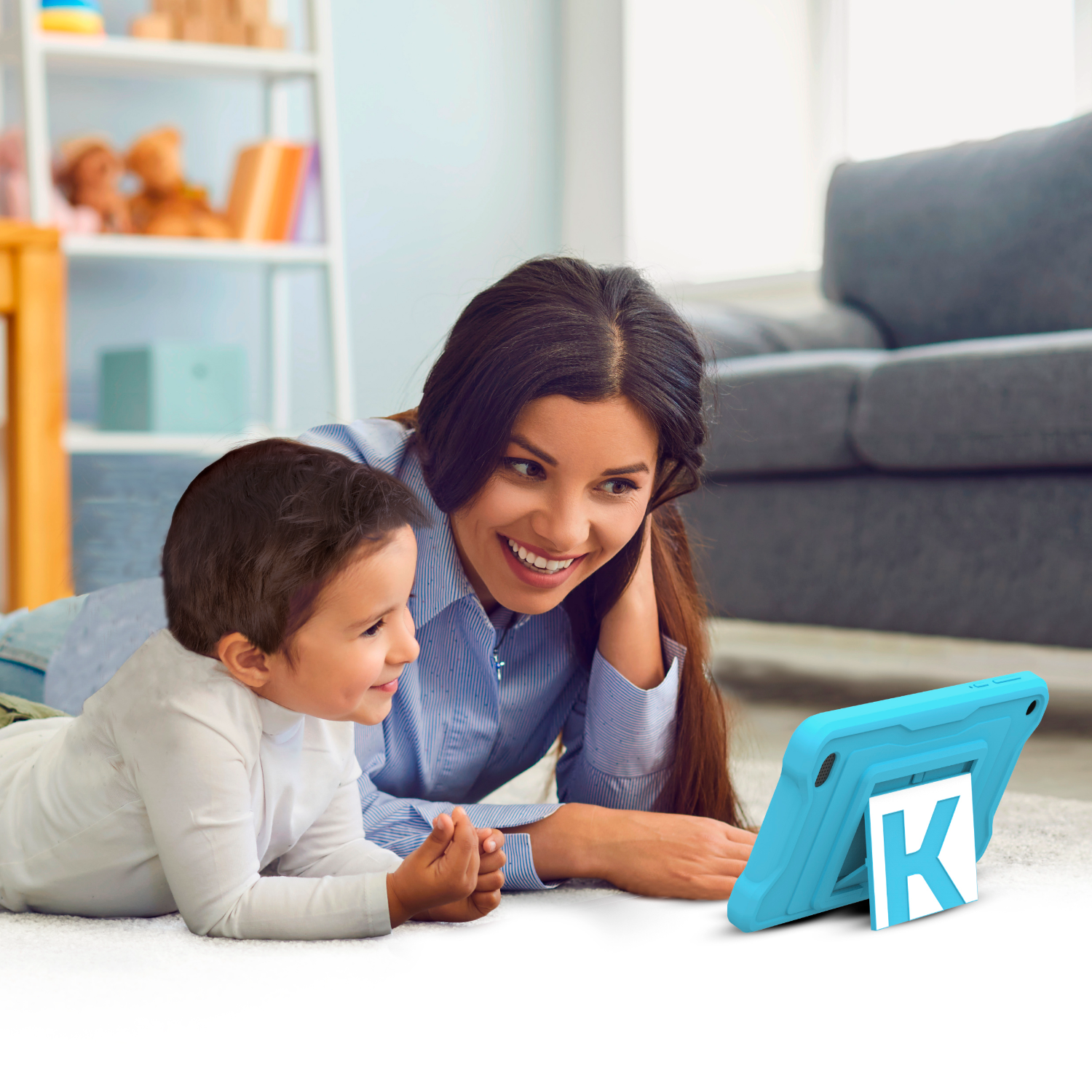 A woman and child looking at a tablet. The child is smiling.