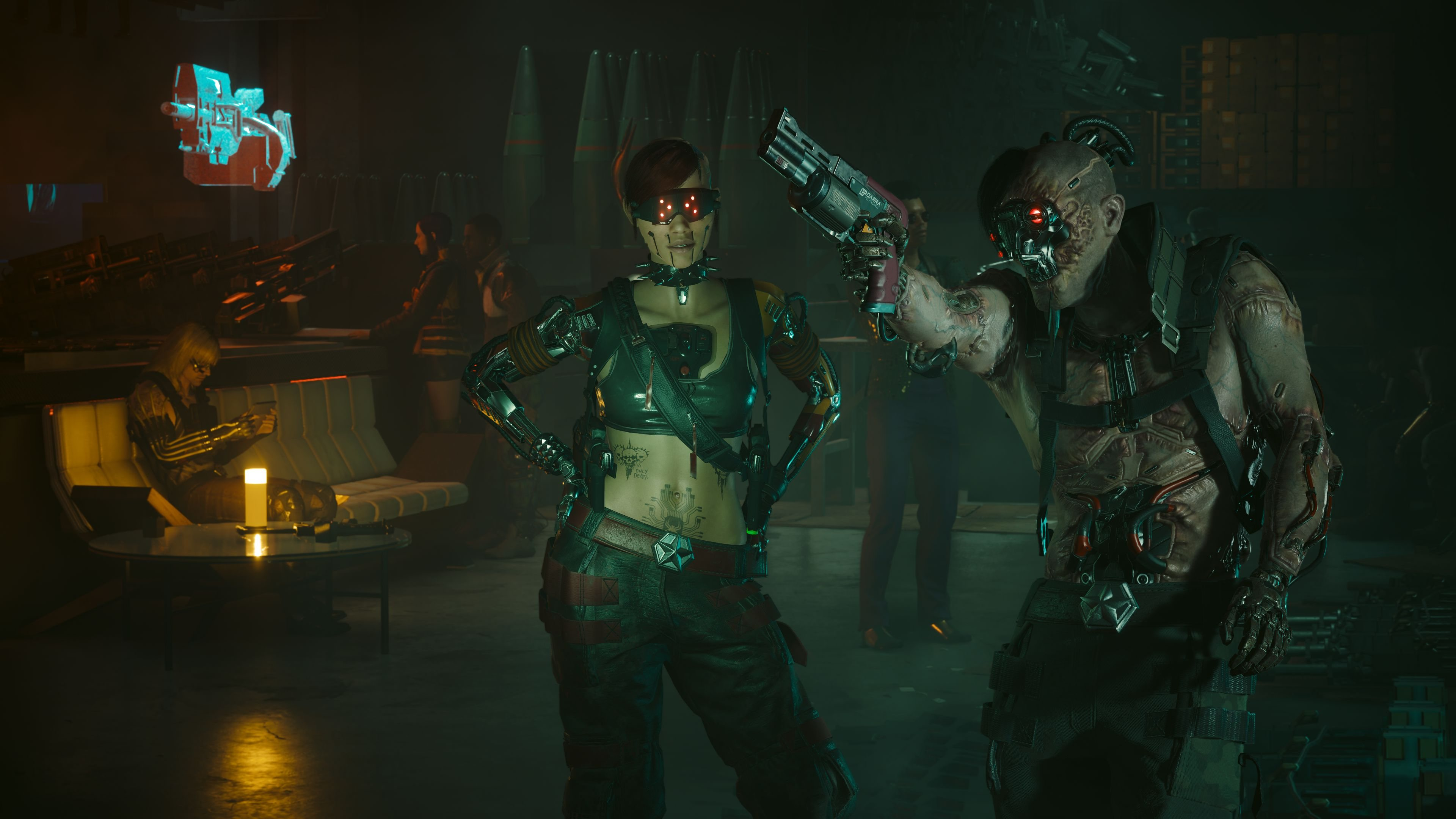 Deux personnages dans une pièce sombre, l'un pointant une arme. Cadre futuriste.