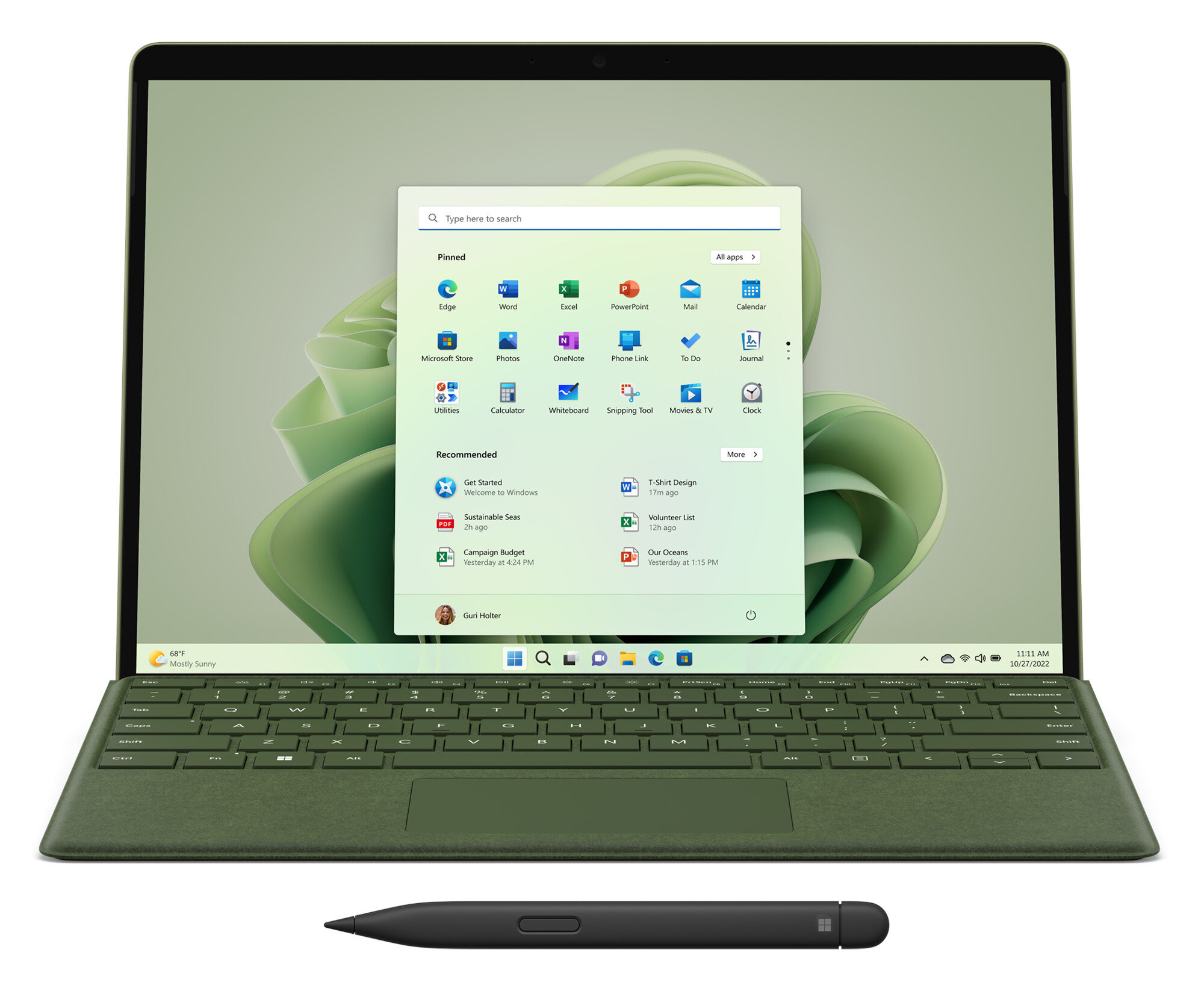 Laptop z zieloną klawiaturą i ekranem pokazującym interfejs Windows z ikonami aplikacji.