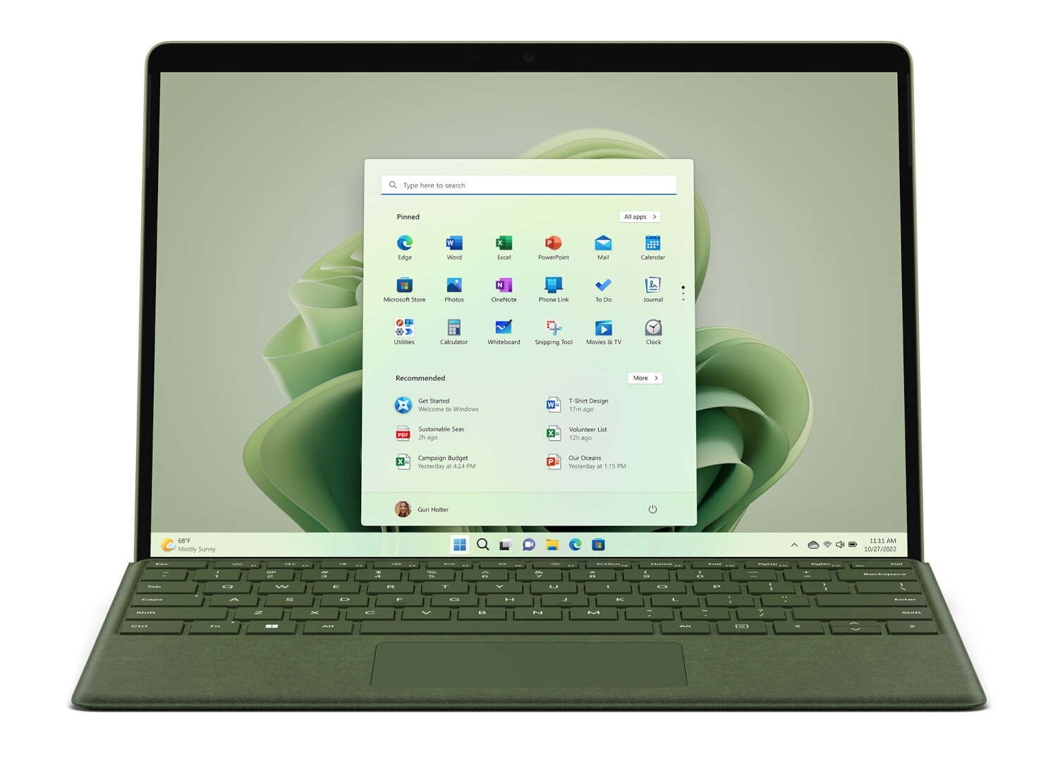 Zielony laptop z interfejsem Windows 11 na ekranie.