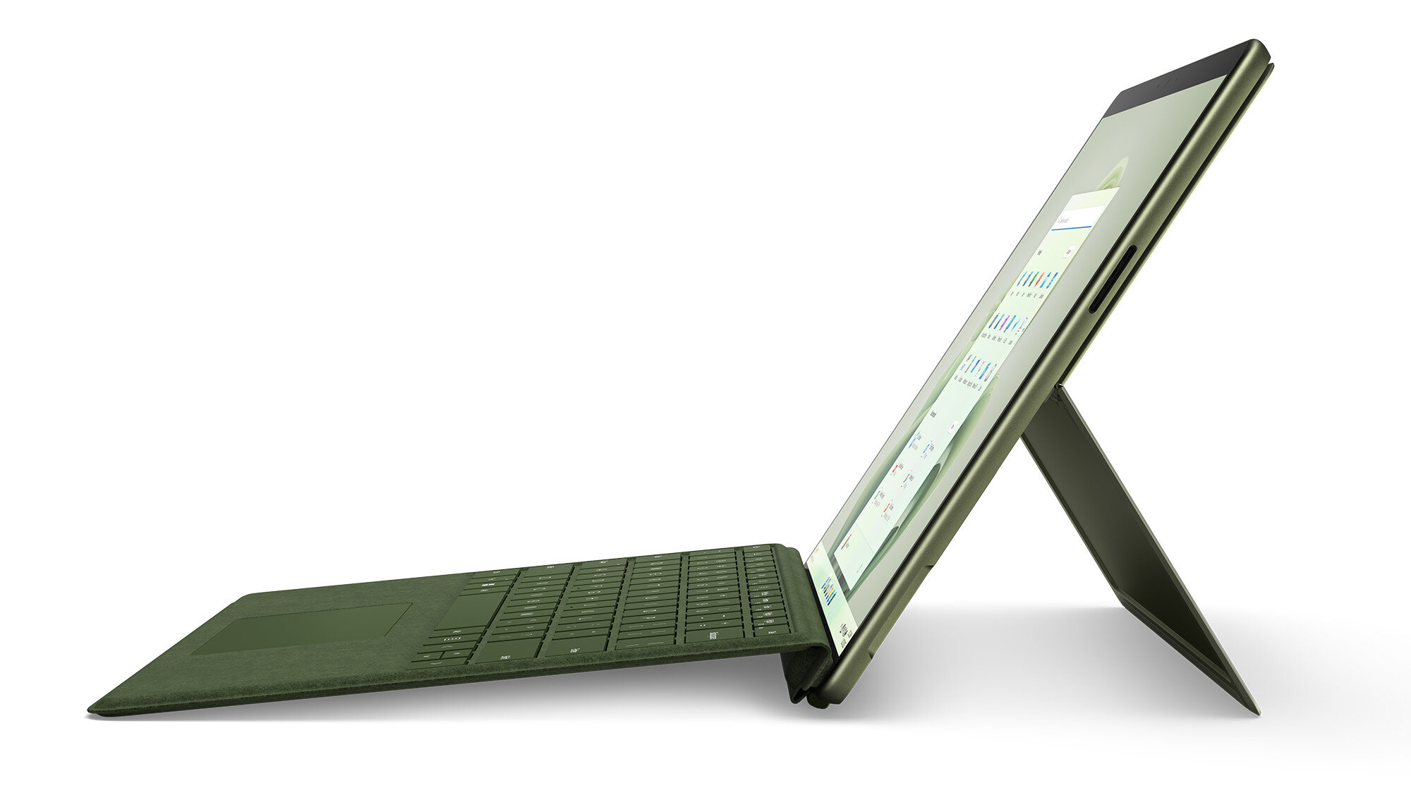 Zielony laptop Surface w pozycji pochylonej z ekranem wyświetlającym wykres biznesowy.