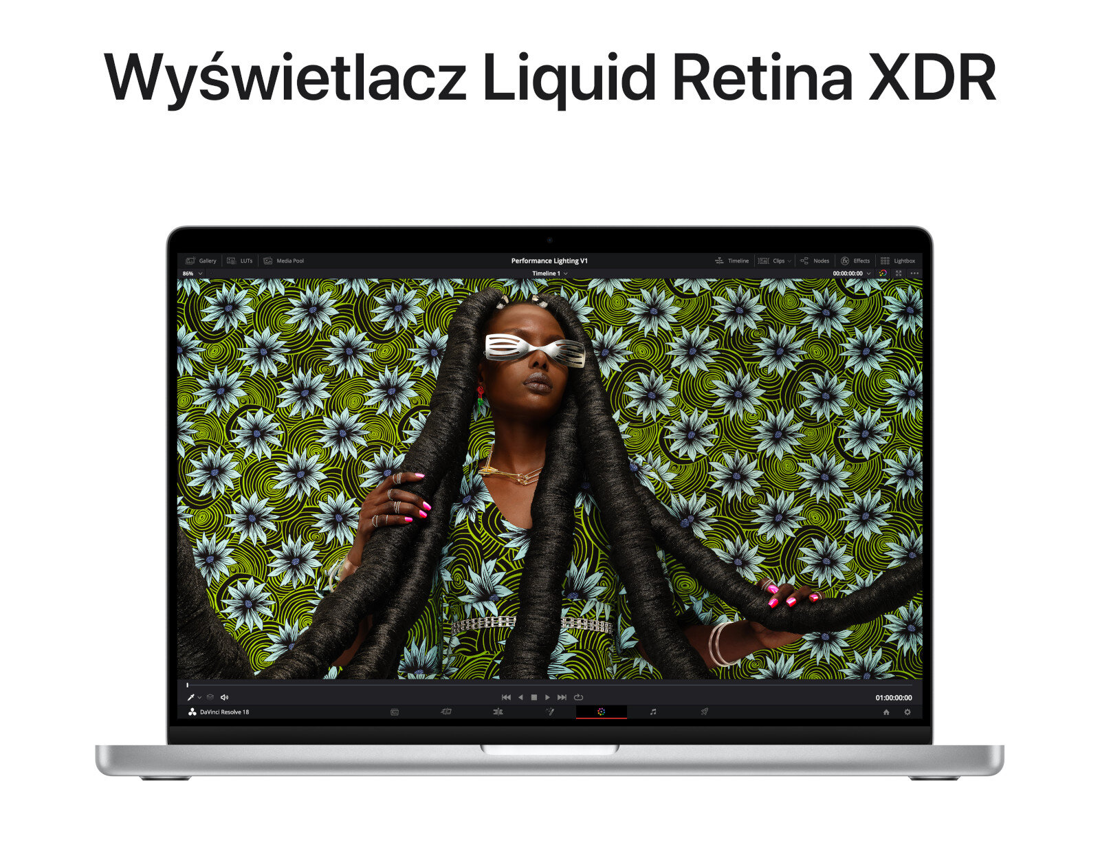 Ekran laptopa pokazuje osobę z dredami w okularach przeciwsłonecznych. Tło ma kwiatowy wzór.