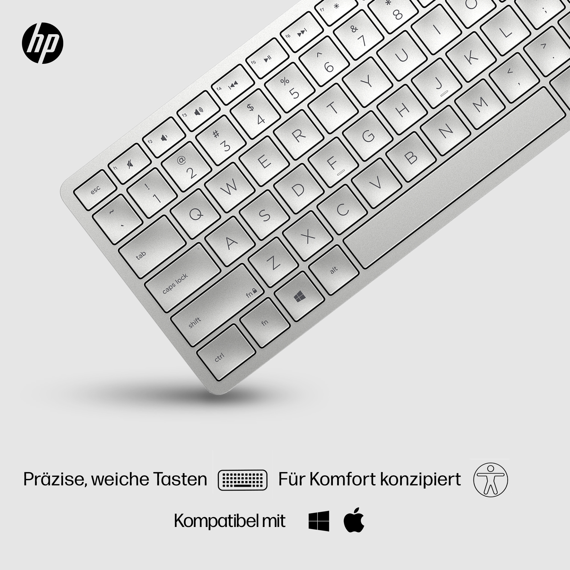 Silberne Tastatur mit weißen Tasten, zeigt die Tasten und das HP-Logo.