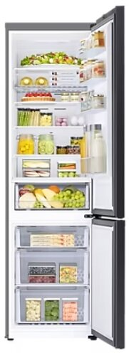 Otwarta lodówka wypełniona jedzeniem. Zawiera owoce, warzywa i pojemniki, uporządkowane na półkach.