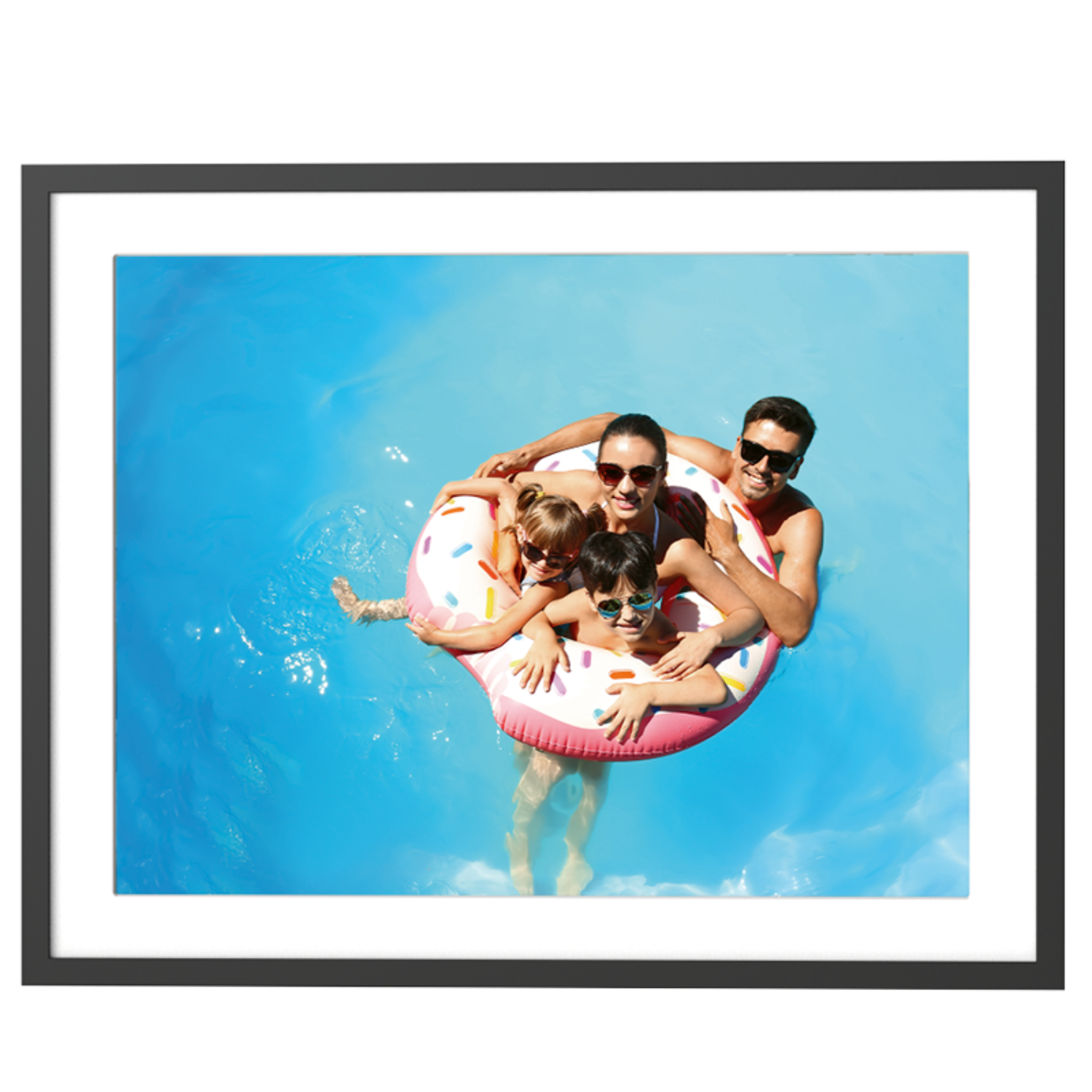 A family in a pool, inside a pink donut-shaped inflatable ring.