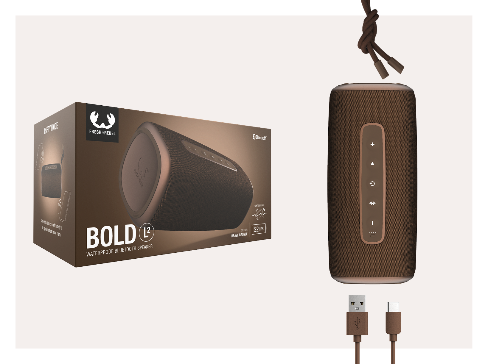 Bruine speaker met doos. USB- en USB-C-kabels. Doos zegt 'BOLD L2' en 'FRESH REBEL'.