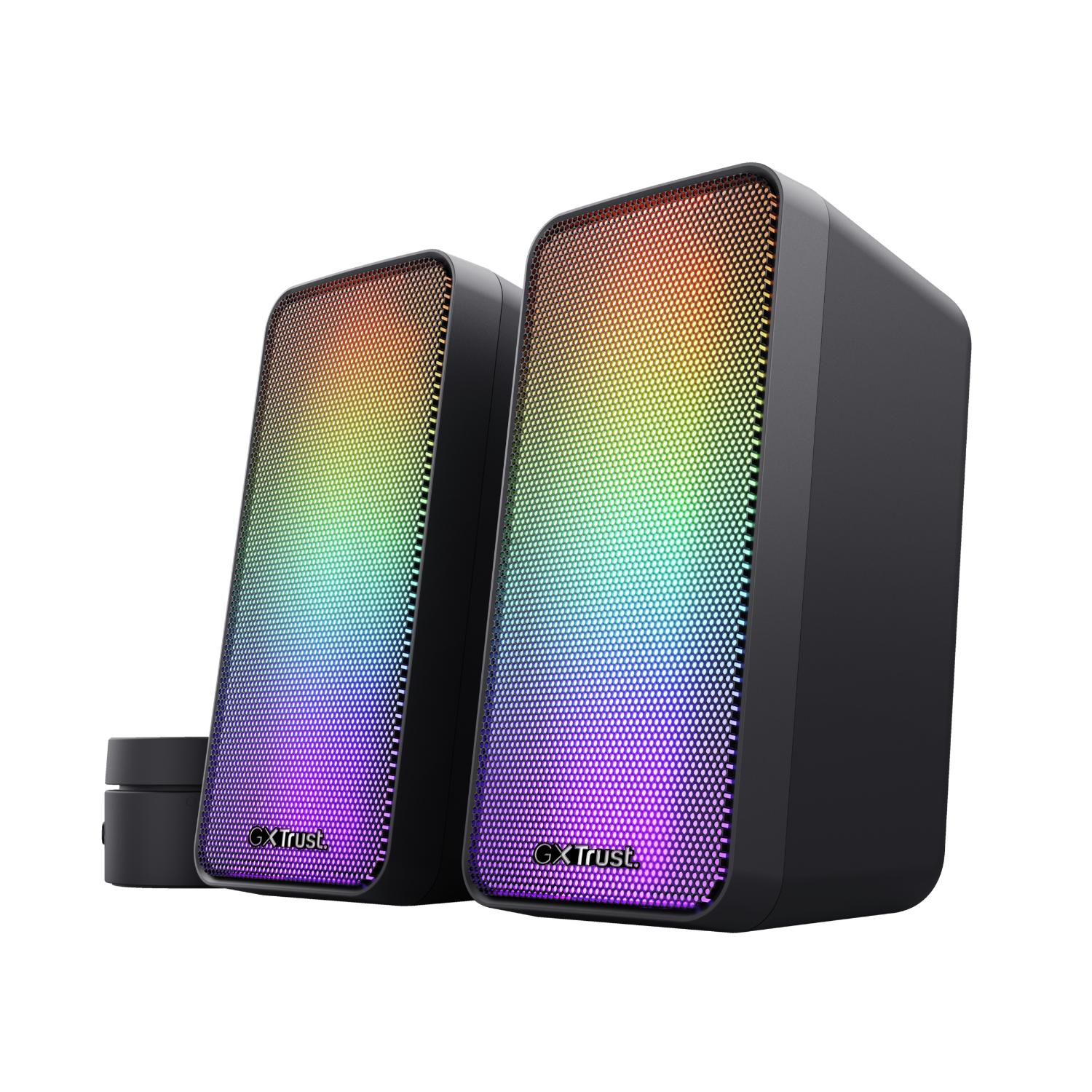 Two black Trust speakers with a gradient of rainbow colors illuminating the front panels.