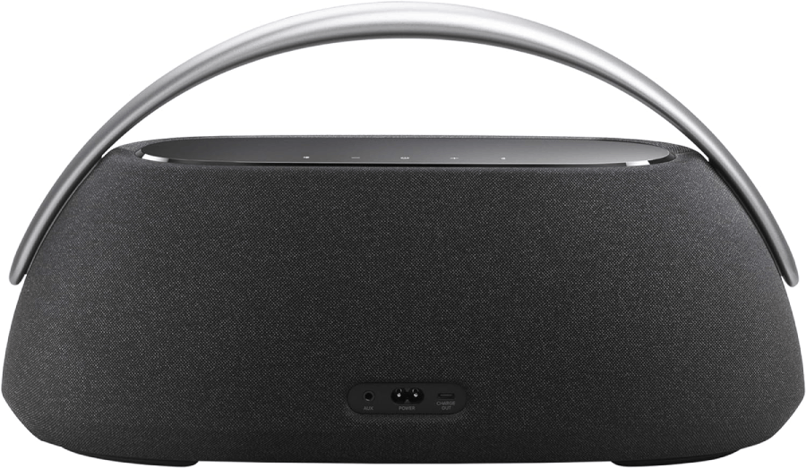 Un altavoz gris oscuro con asa plateada sobre fondo blanco.