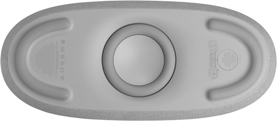 Vista inferior de un altavoz gris con forma ovalada. Tiene un anillo central y dos soportes en arco.