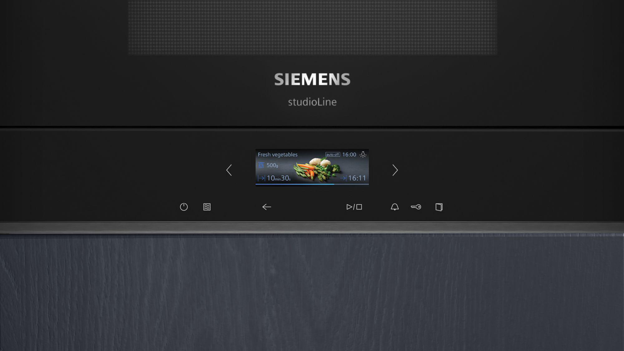 Siemens studioLine Mikrowelle mit digitalem Display, das Gemüse und Zeiteinstellungen zeigt.