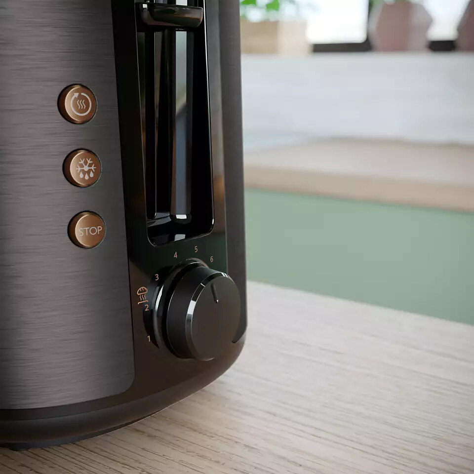 Czarny toster z przyciskami sterowania. Przyciski są złote, a toster ma pokrętło do ustawień.
