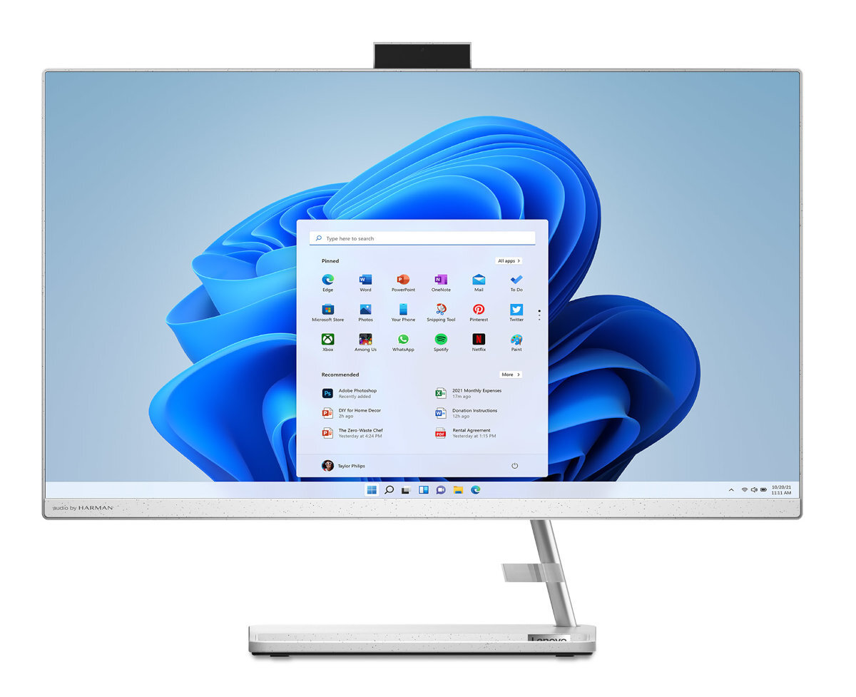 Biały komputer typu all-in-one z dużym ekranem wyświetlającym menu aplikacji, umieszczony na białej i szarej podstawie.