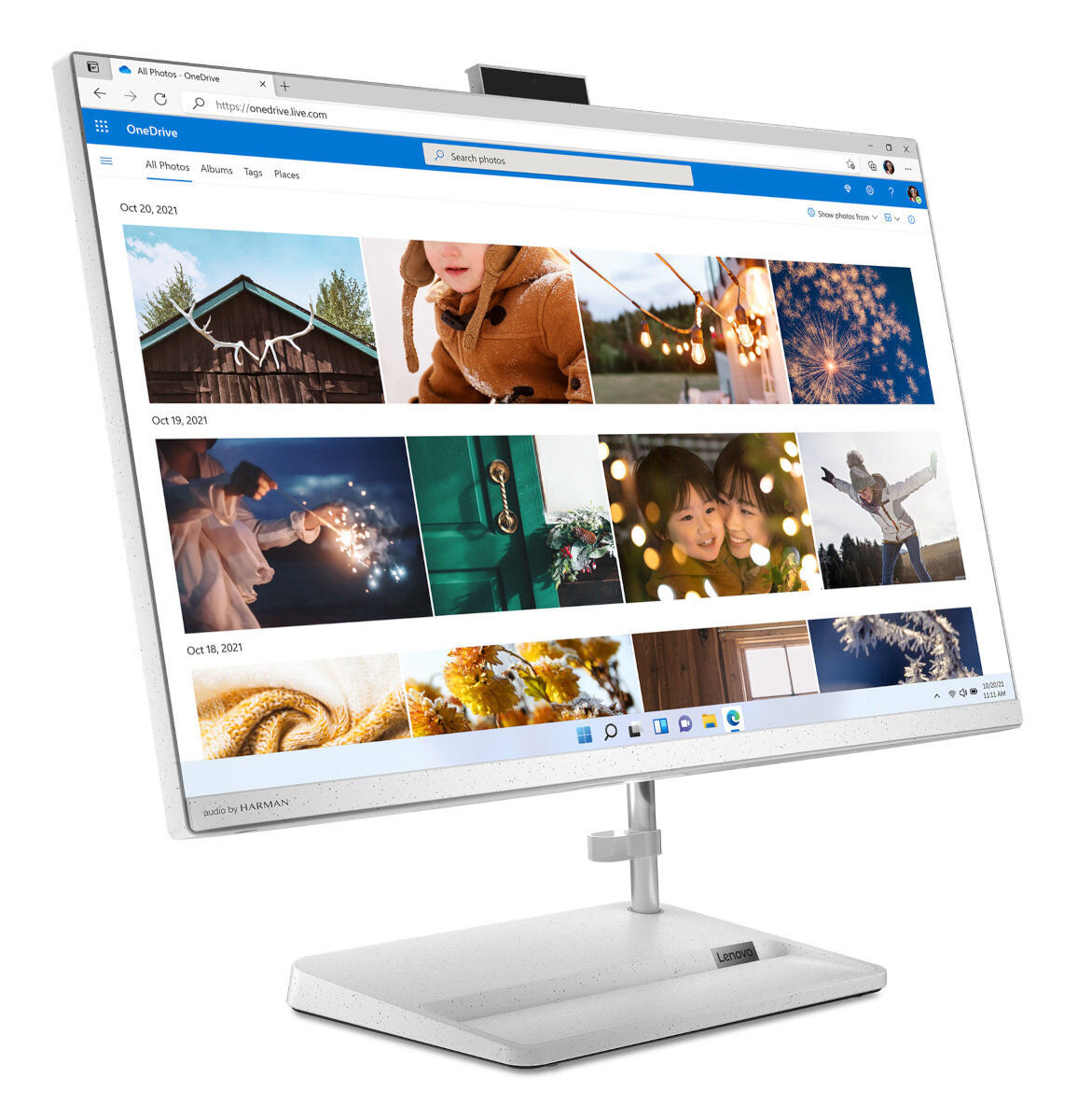 Biały komputer All-in-one z ekranem wyświetlającym zdjęcia. Biała podstawa i stojak.