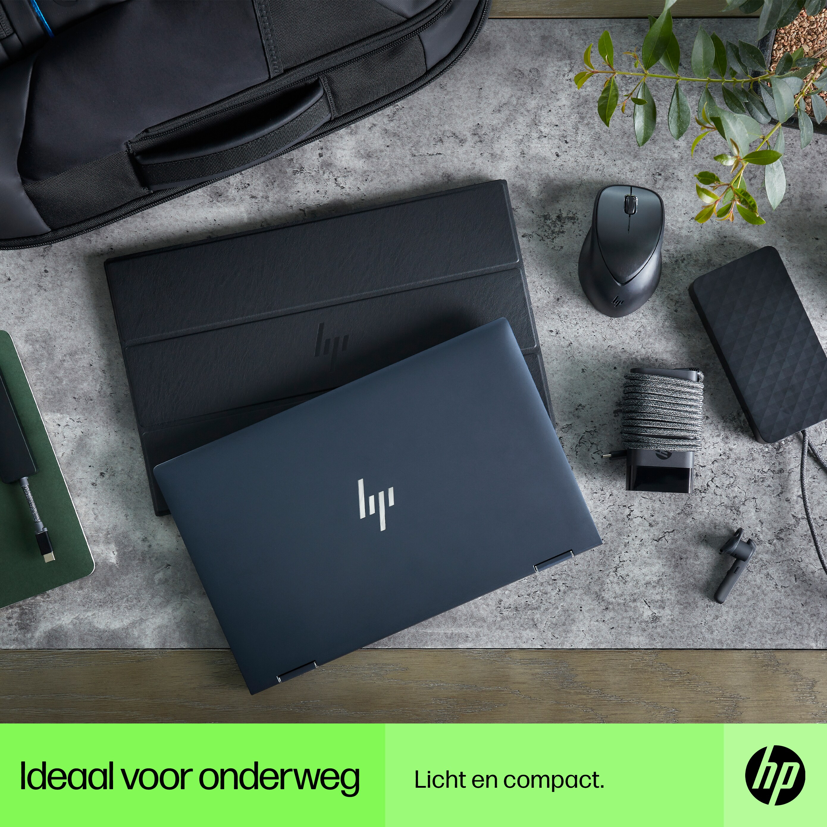 Laptop on a table with accessories, and the text 'Ideal for on the go' and 'light and compact'.