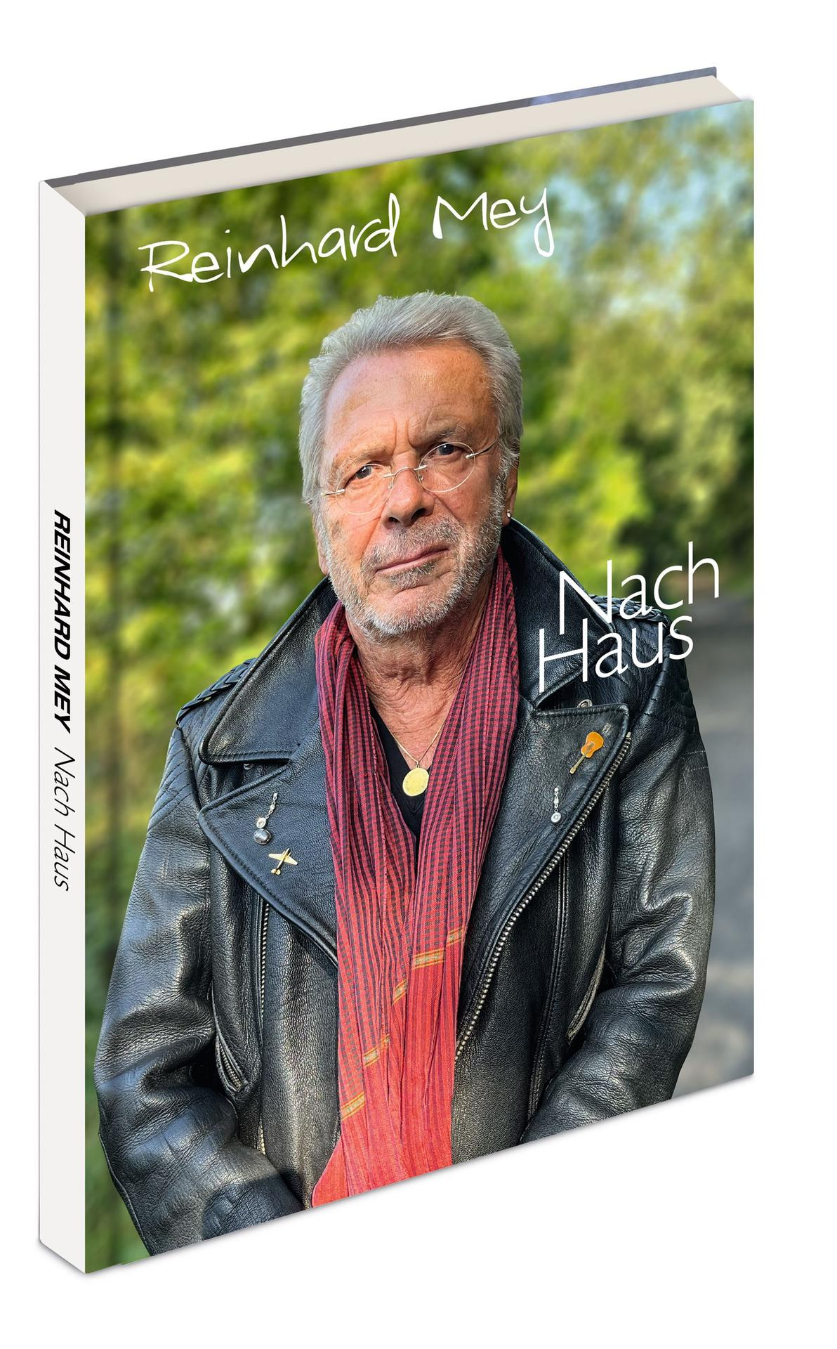 Buchcover mit Reinhard Mey, Titel: Nach Haus, und einem Porträtfoto.