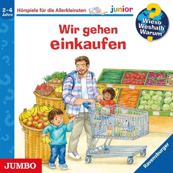 Vater mit zwei Kindern im Supermarkt vor Regalen mit Obst und Gemüse.