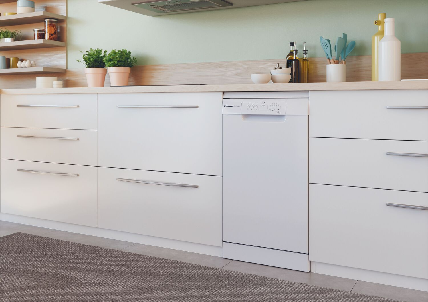 Cocina blanca con lavavajillas y armarios blancos, con pared verde claro.