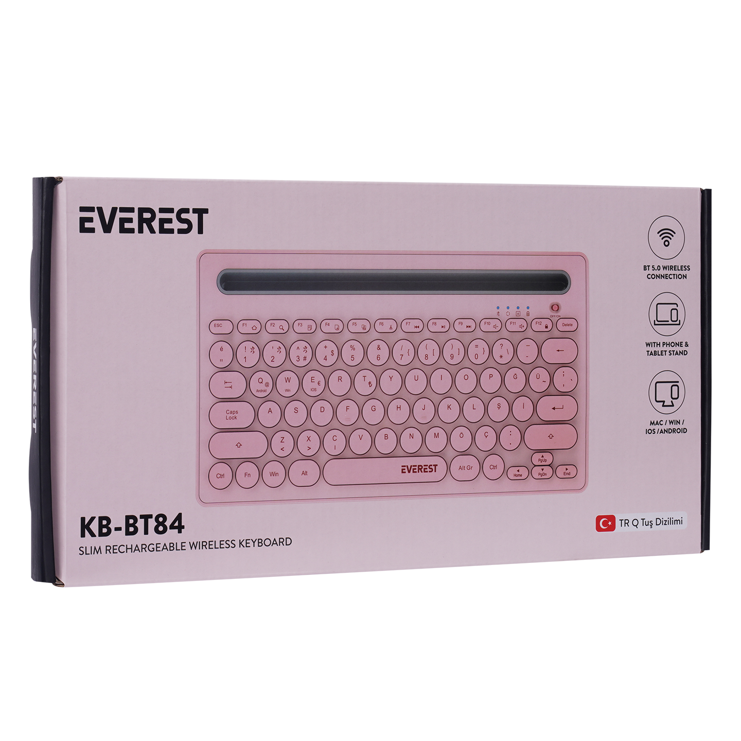 Ambalajında pembe bir kablosuz klavye, beyaz bir arka plan üzerinde duruyor.