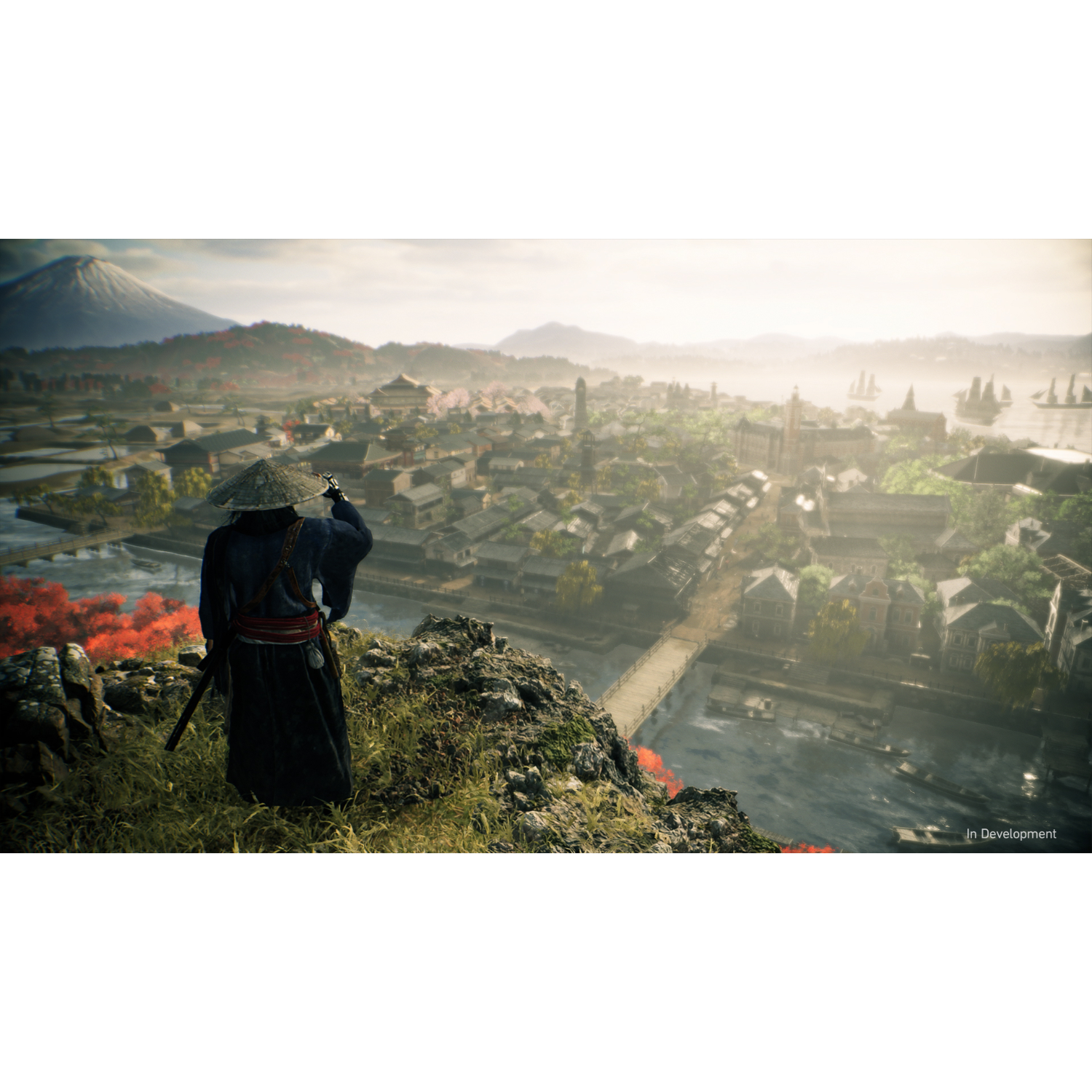 A samurai on a cliff observes a city. The city has buildings and a river. A mountain is in the background.