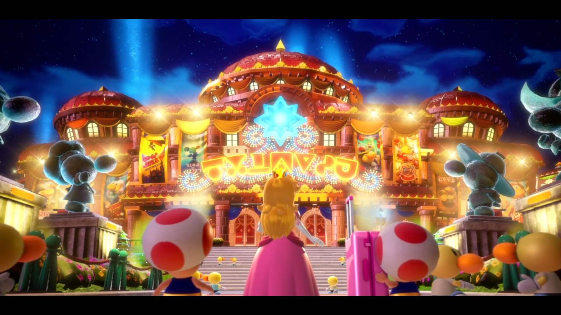 Prenses Peach, ışıklar ve Toads ile büyük bir binanın önünde.