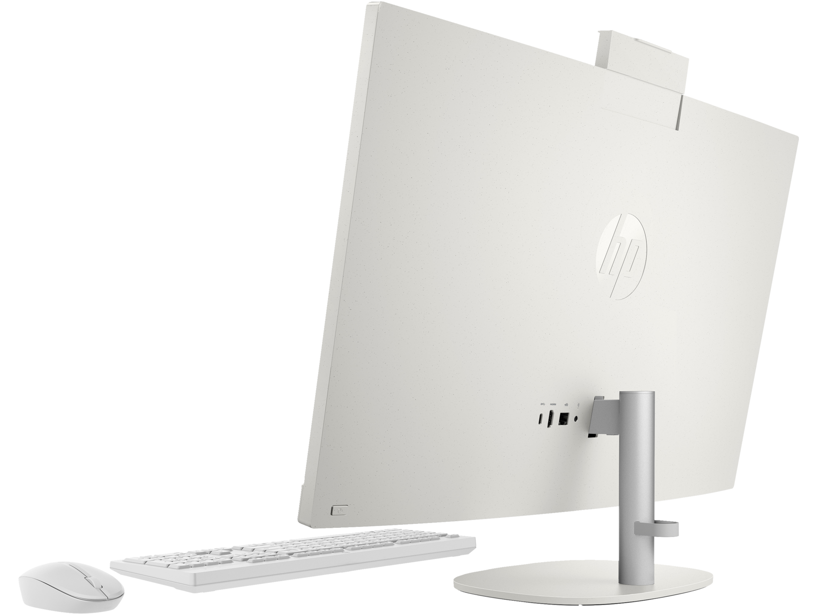 Vista trasera de un ordenador blanco todo-en-uno, con teclado y ratón blancos.