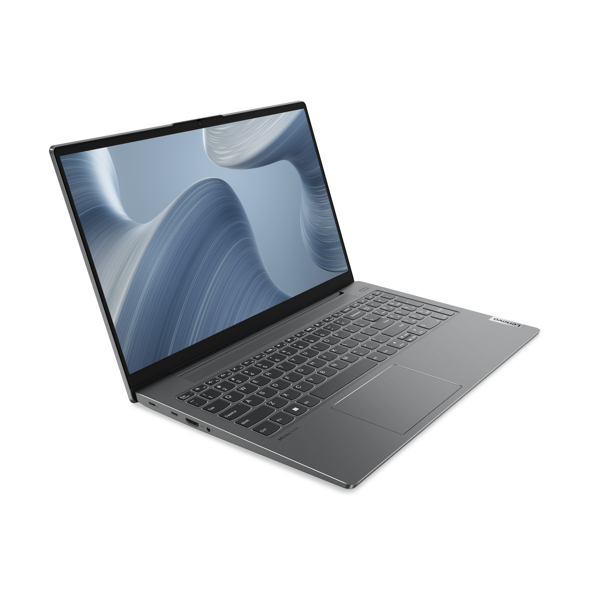 Laptop gris oscuro sobre fondo negro. La pantalla muestra un diseño abstracto azul y gris.
