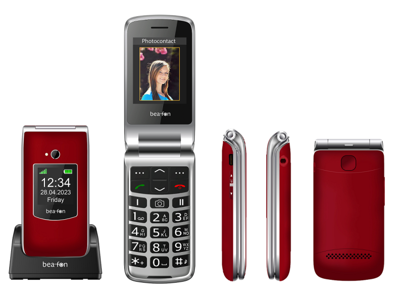 Piros és ezüst kagylótelefon töltőállomáson. Időt, dátumot és egy fotót jelenít meg.