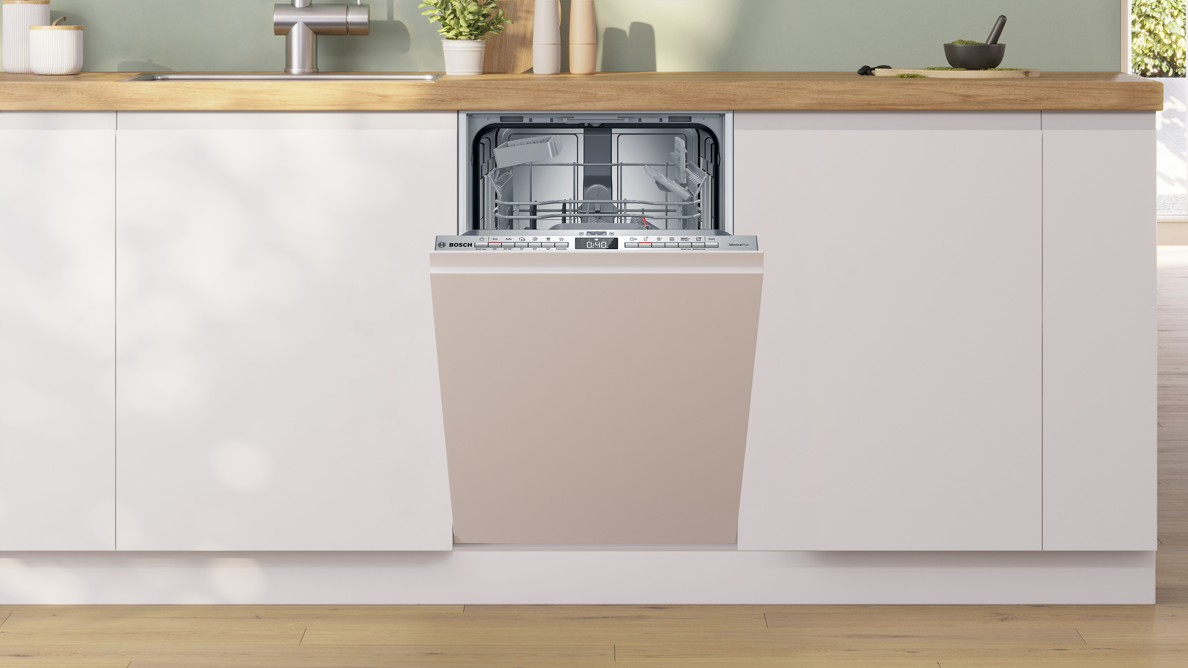 Ein eingebauter Geschirrspüler ist geöffnet. Er ist beige, die Tür steht leicht offen.