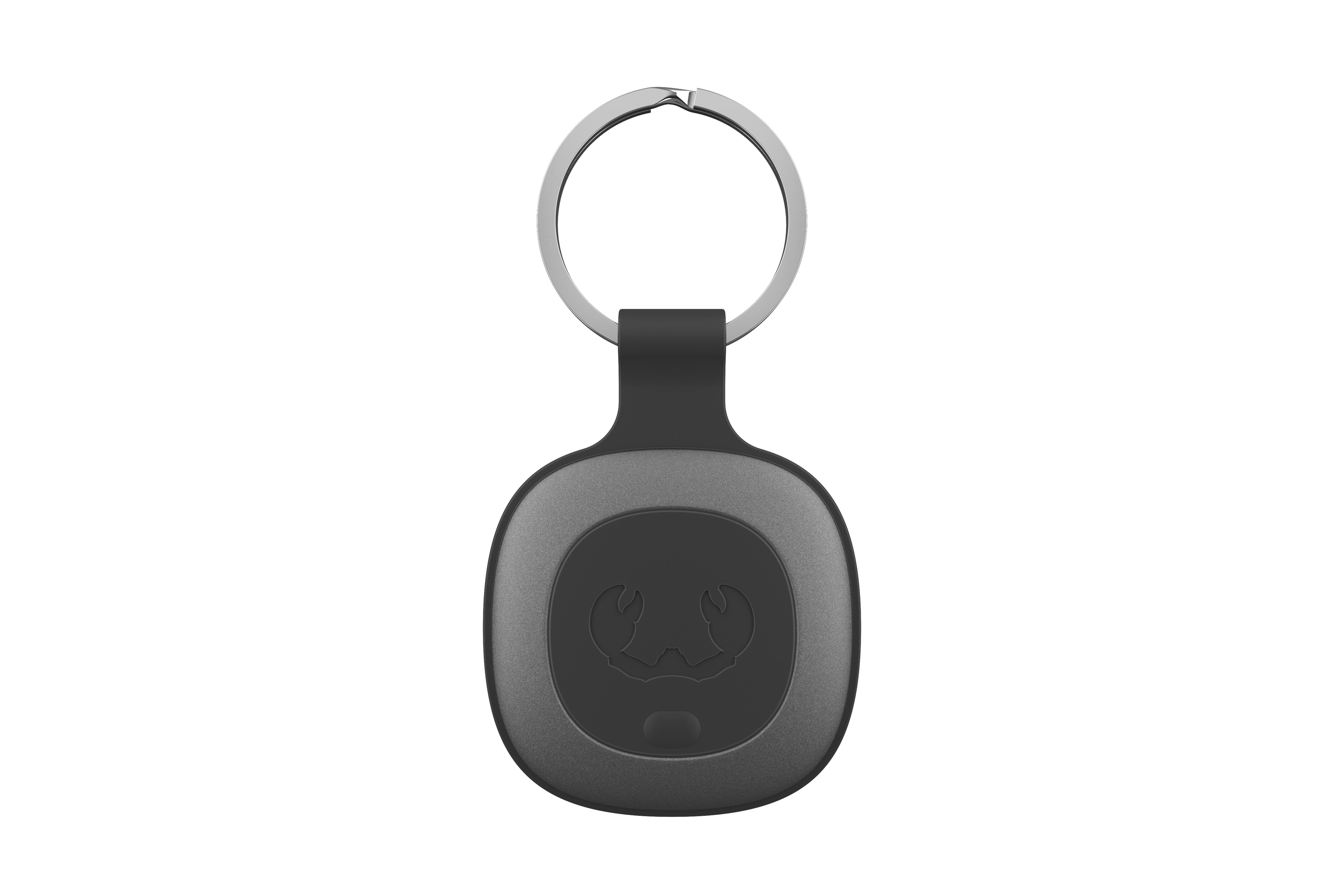 Ein schwarz-grauer Schlüsselanhänger mit einem krabbenartigen Emblem und einem silbernen Ring.