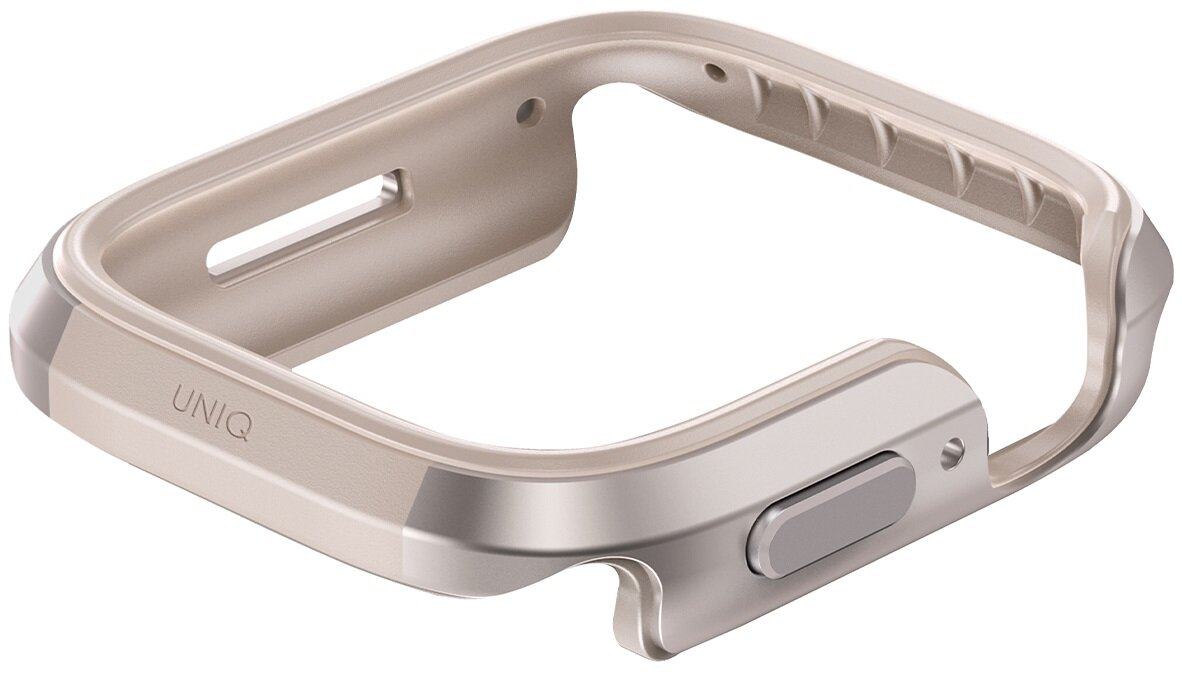 Beżowo-srebrna obudowa zegarka. Widoczne zaokrąglone krawędzie, przycisk i słowo 'UNIQ'.