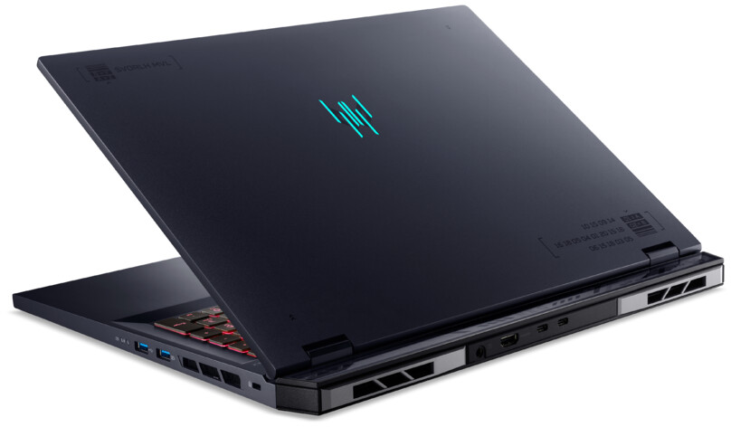 Dunkelblauer Laptop mit leuchtendem Logo auf der Rückseite, teilweise geöffnet.