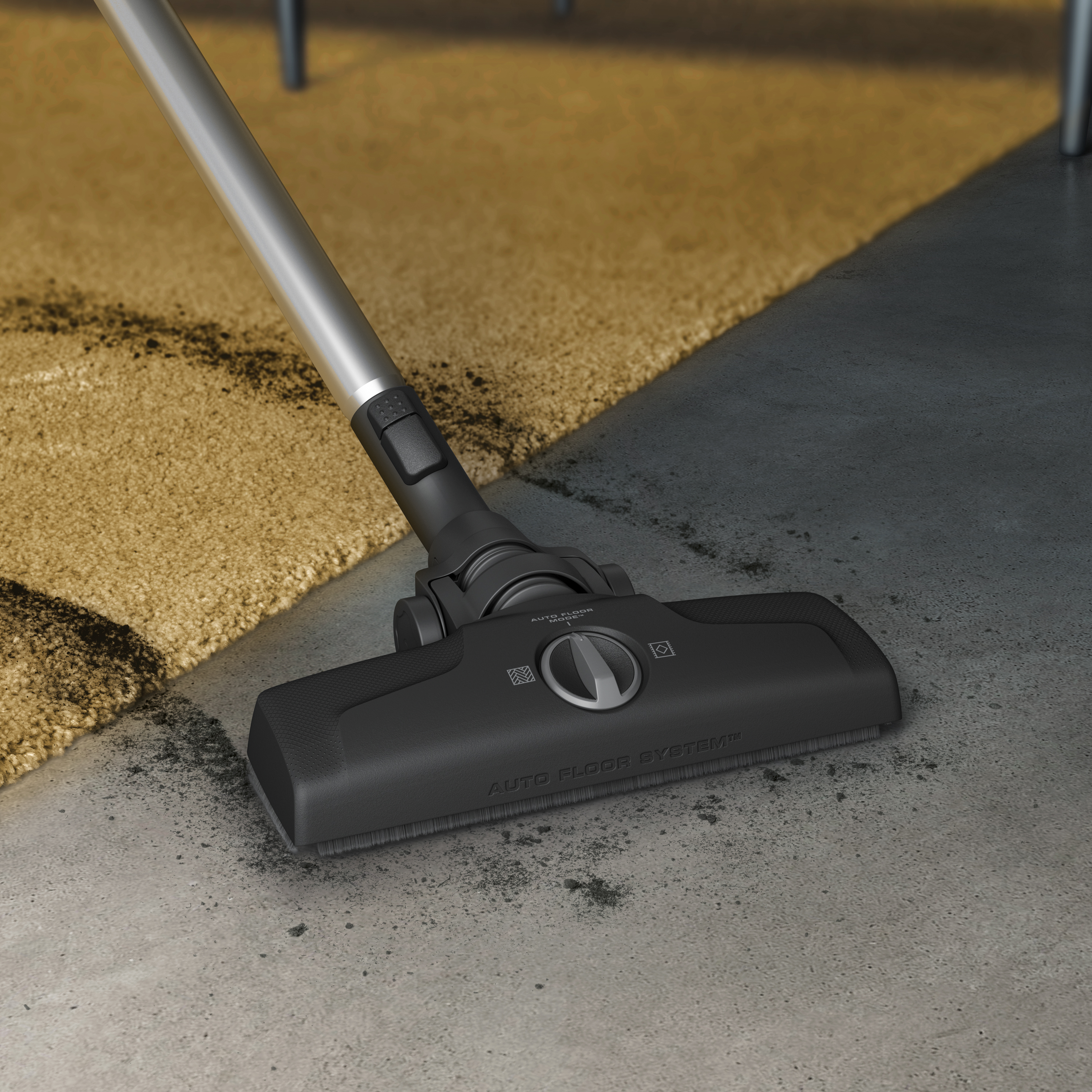 Vacuum cleaner head cleaning a carpet on a grey and beige surface.