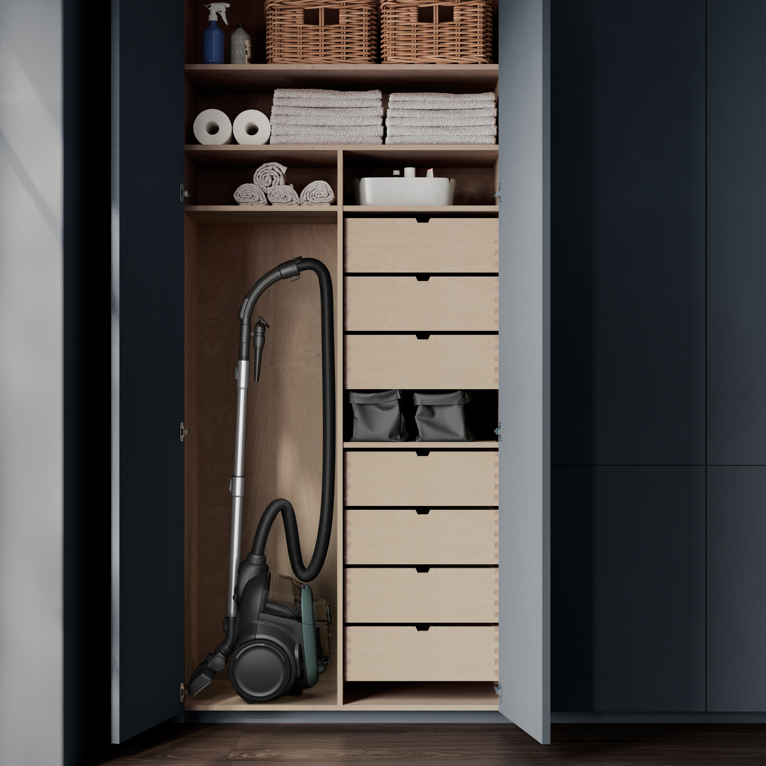 Open closet with vacuum cleaner, shelves with towels and baskets, and drawers filled with items.