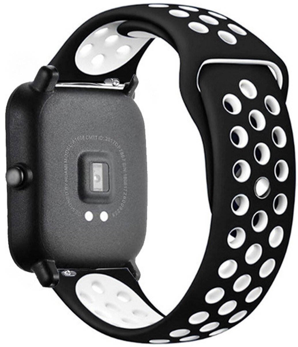 Czarno-biały smartwatch z paskiem z białymi perforowanymi otworami.