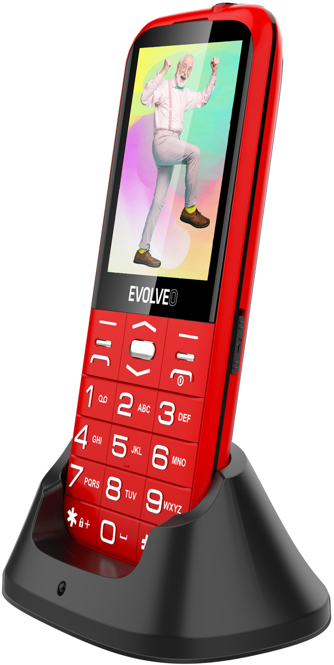 Piros-fekete telefon a képernyőn egy emberrel. Egy töltőállványon van.