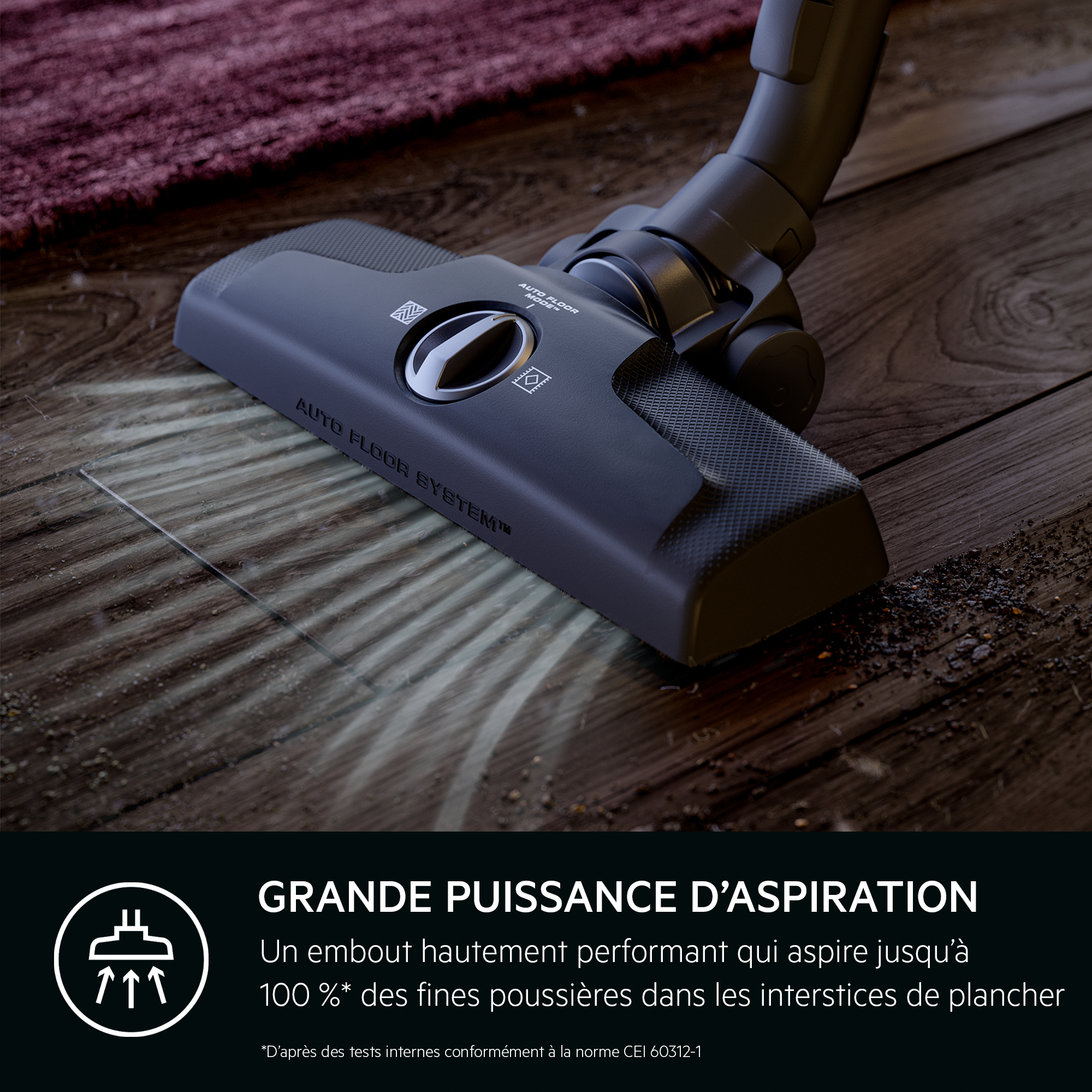 Tête d'aspirateur sur plancher en bois. Le texte dit 'Grande puissance d'aspiration'.
