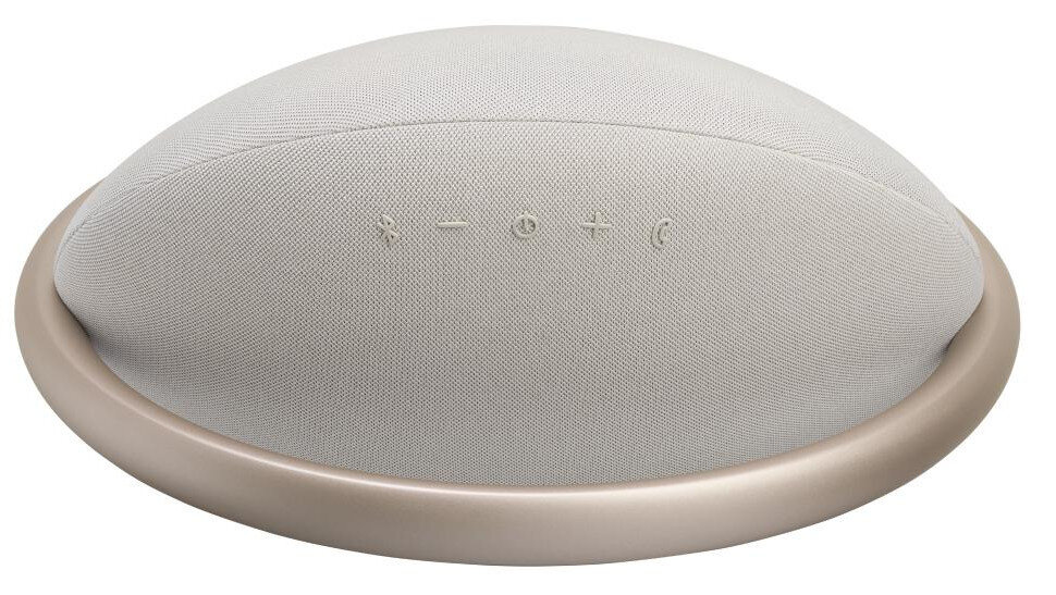 Jasnobrązowy głośnik o owalnym kształcie z przyciskami sterowania i złotą podstawą.