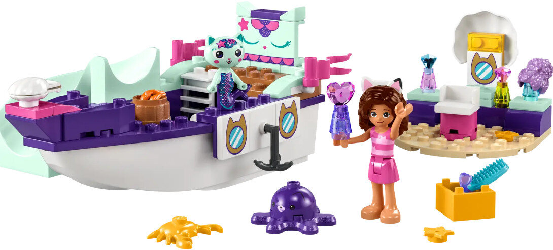 Zestaw Lego z łodzią, figurkami i akcesoriami. Zawiera dziewczynkę trzymającą sukienki i kota.