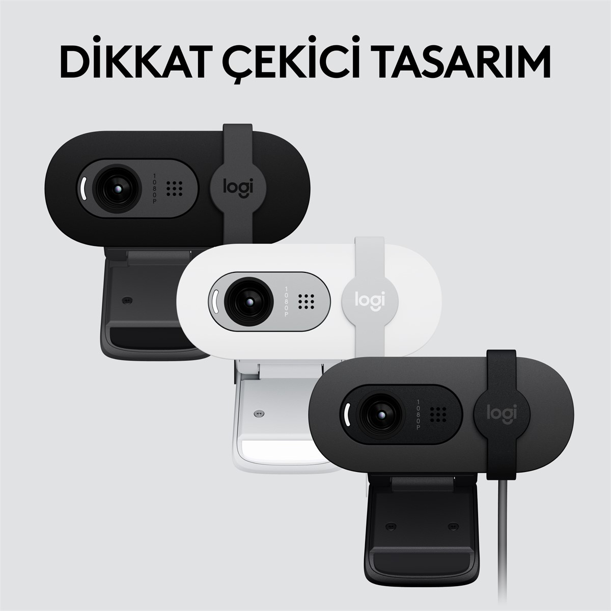 "logi" kelimesiyle siyah, beyaz ve siyah renklerde üç Logitech web kamerası.