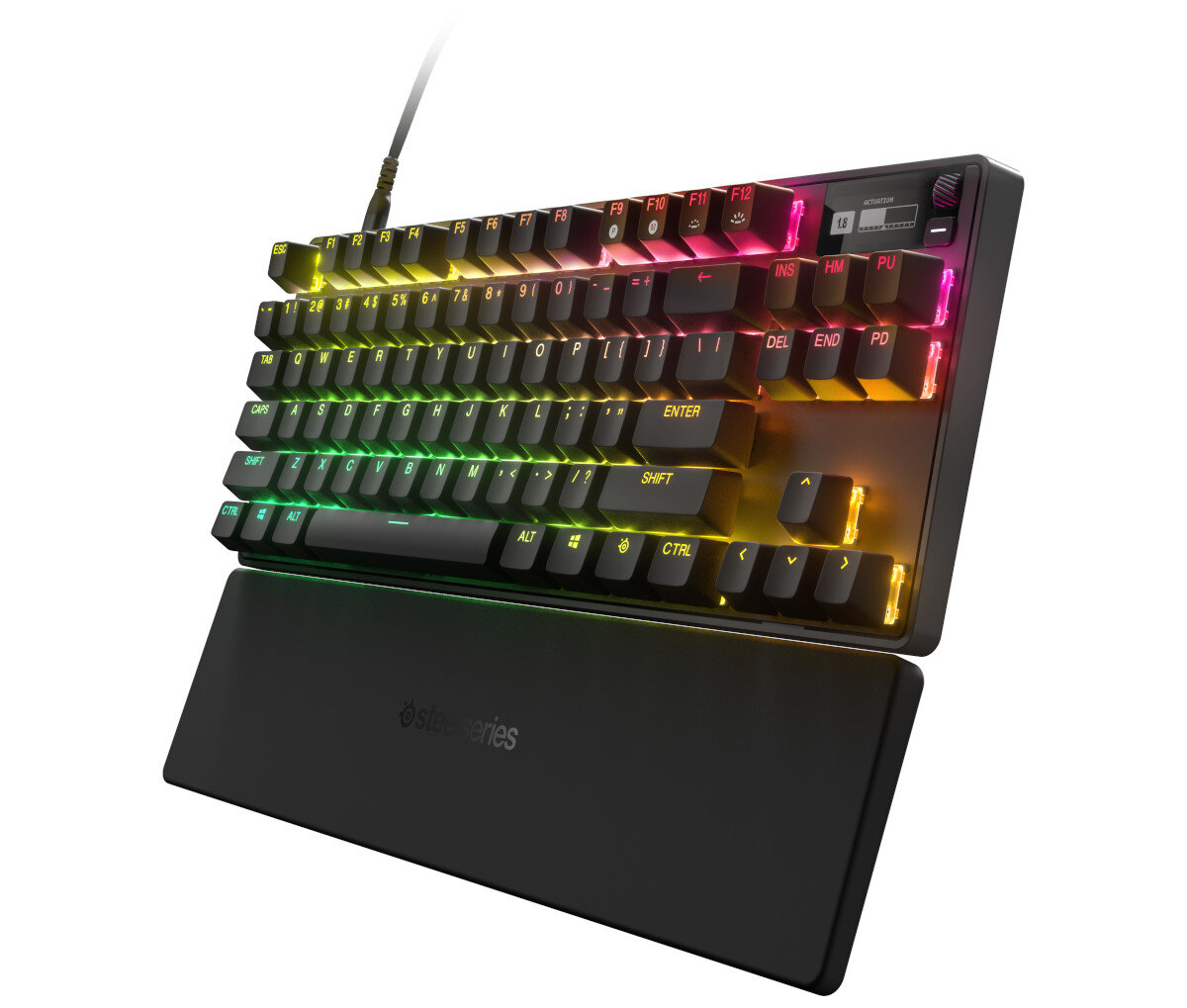 Czarna klawiatura z podświetleniem RGB, przymocowana do podpórki pod nadgarstek, z różnymi klawiszami i wyświetlaczem.