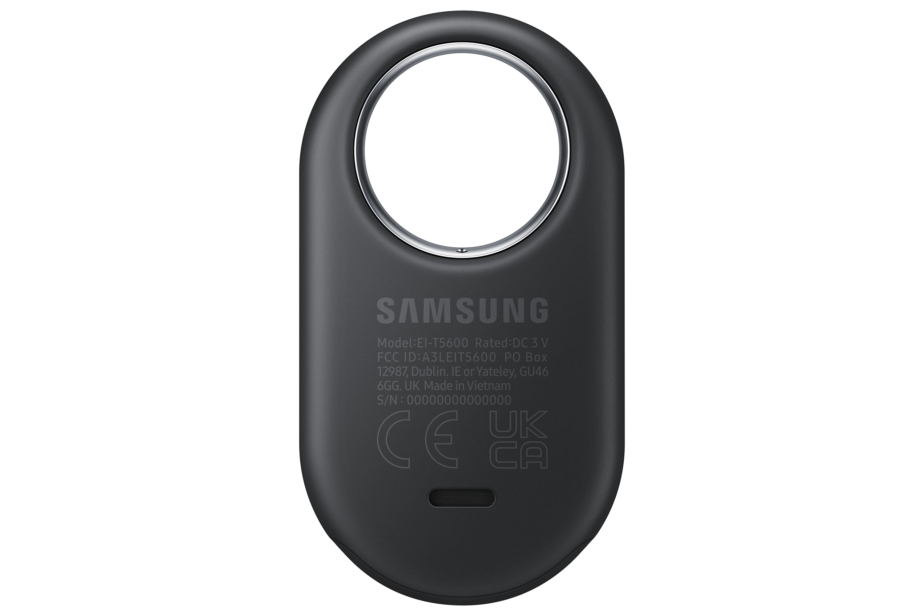 Gümüş bir halkaya sahip siyah, oval şeklinde bir cihaz. Arkasında Samsung logosu ve diğer detaylar bulunuyor.