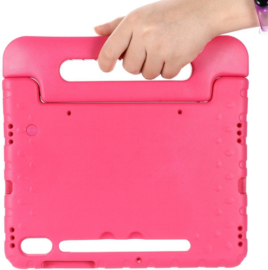 A hand holds a pink tablet case with a handle. The case is made of a soft, textured material.