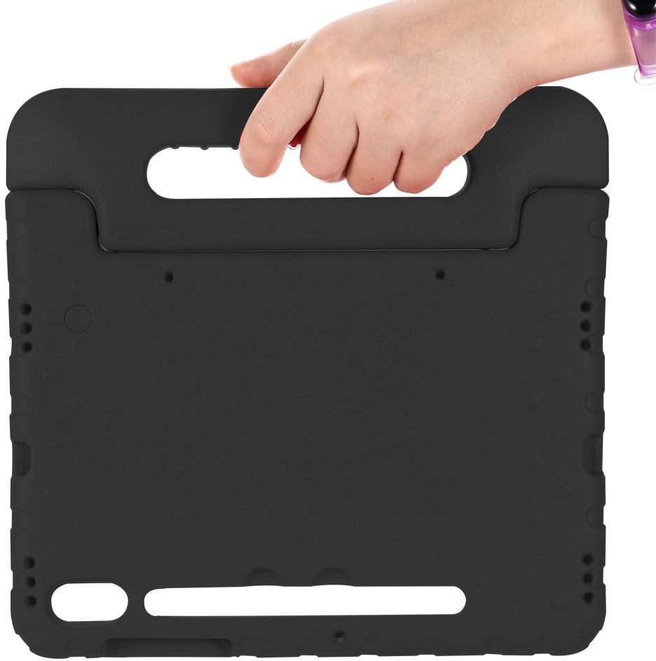 A black tablet case being held by a hand.