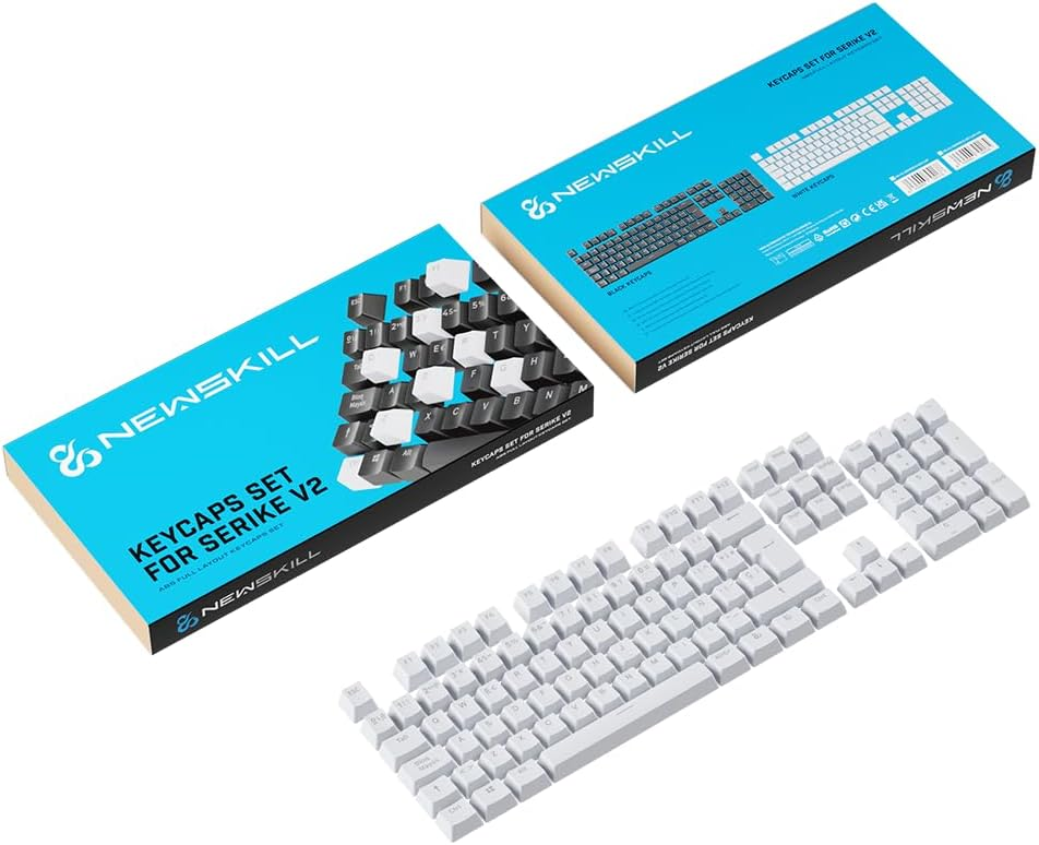 Teclas de teclado, cajas y un juego de teclas blancas. Primer plano: teclas. Fondo: cajas.