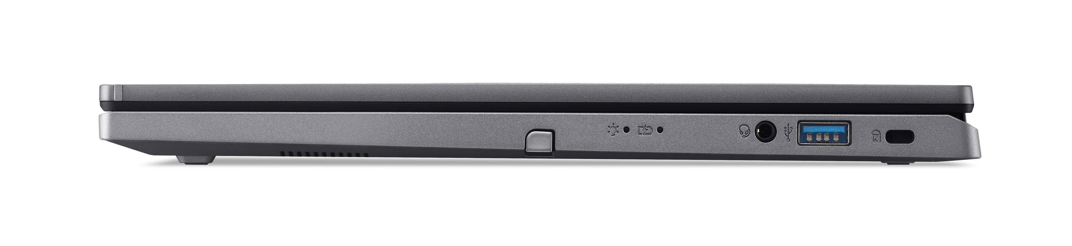 Seitenansicht eines grauen Laptops, Anschlüsse sichtbar. Weißer Hintergrund.