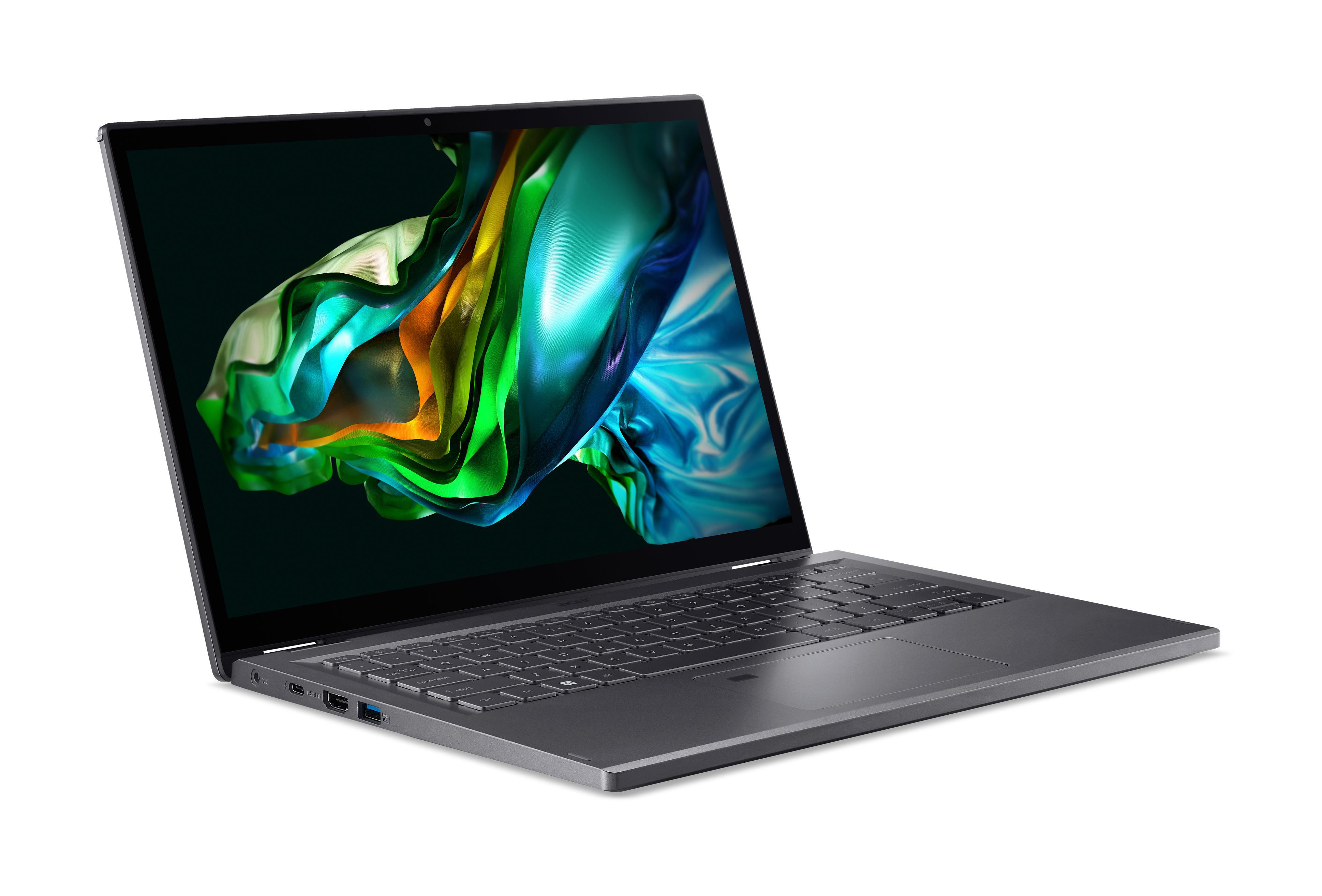 Ein silberner Laptop ist geöffnet, mit einem farbenfrohen Bildschirm. Er steht auf einer weißen Oberfläche.