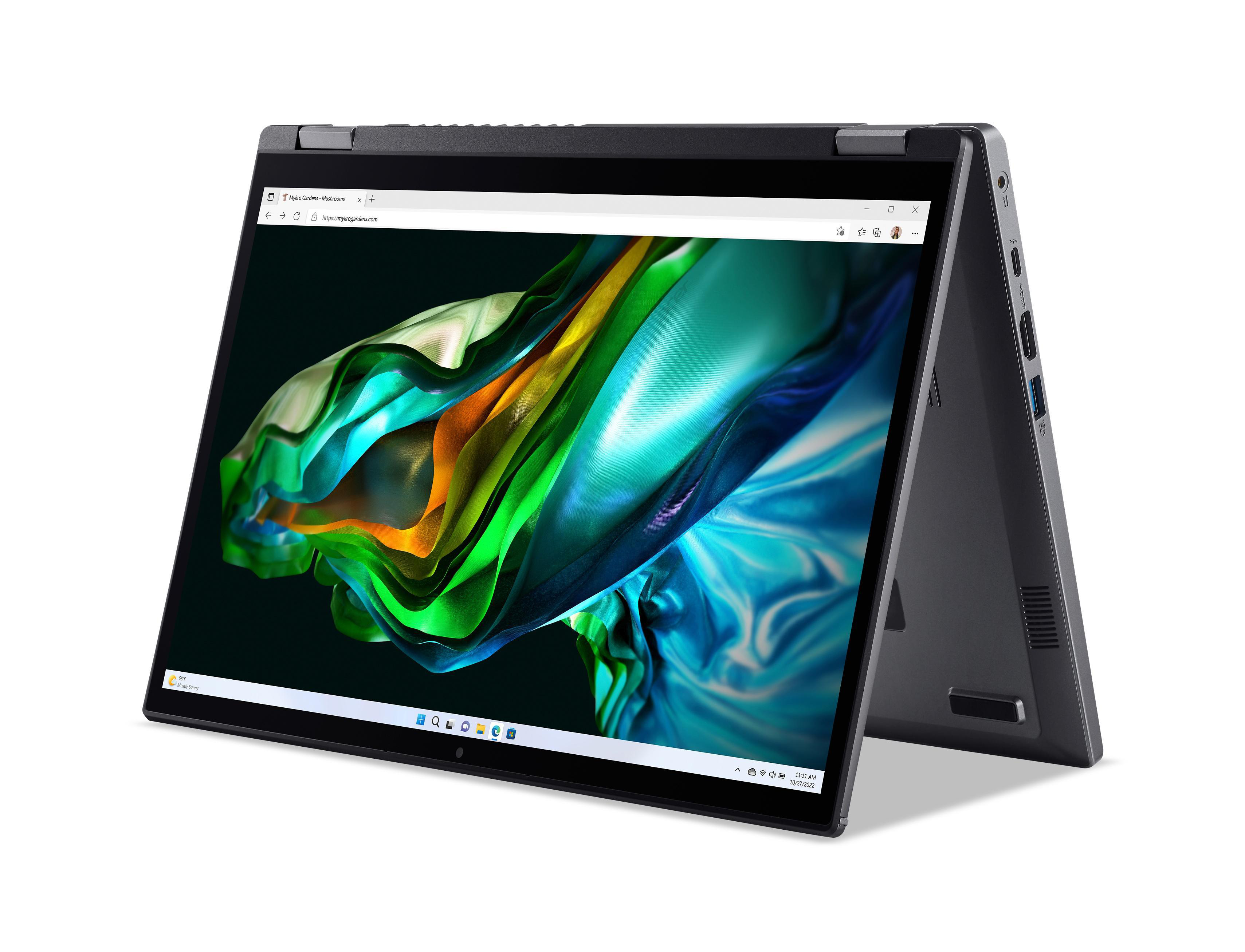 Ein schwarzer Laptop mit einem Bildschirm, auf dem farbenfrohe abstrakte Kunst zu sehen ist.