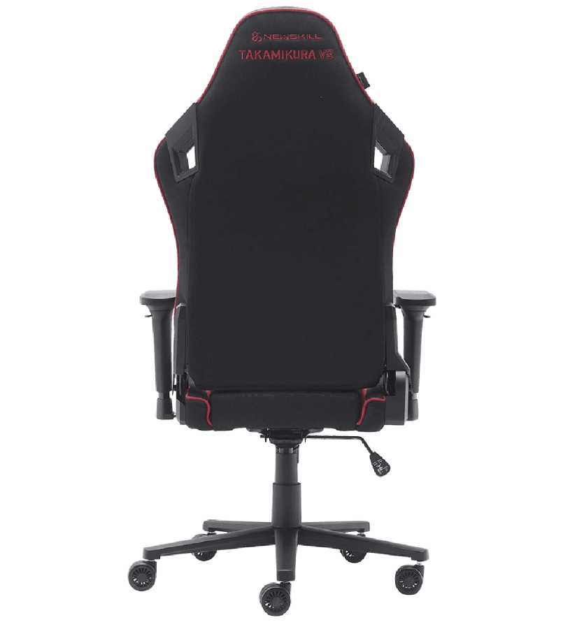 Silla gaming, negra con detalles rojos. La vista trasera muestra el reposacabezas y el soporte lumbar.