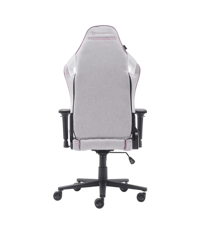 Vista trasera de una silla gamer con respaldo gris y base negra.